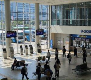  The interior of Gwangju's U-Square Bus Terminal, with buses visible through the windows, the starting point for a DIY trip to Boseong.