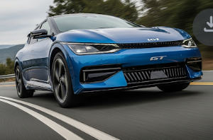 A dynamic, low-angle action shot of the high-performance Kia EV6 GT driving on a winding road.