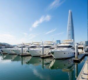  A view of several pristine, high-end yachts docked at Seoul Marina on a bright, sunny day, representing the quality and choice available for rental.
