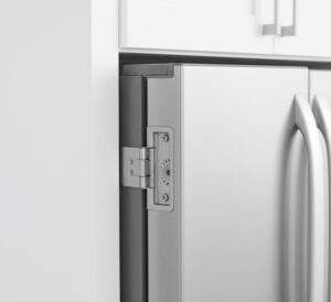 A close-up shot of a Bosch 800 series refrigerator's zero-clearance hinge, showing the door open 90 degrees and flush with the adjacent white wall.