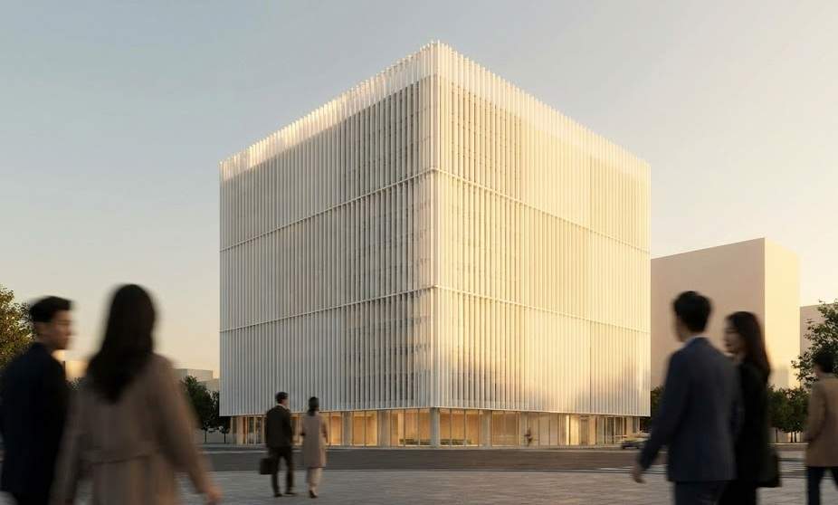 A wide-angle landscape view of the Amorepacific Headquarters building in Yongsan, Seoul, glowing during golden hour with blurred people walking in the foreground.