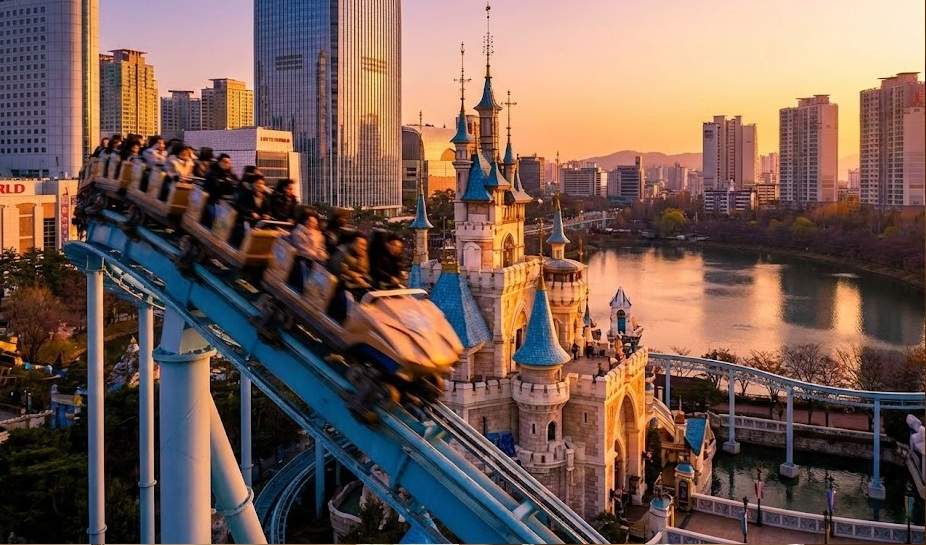 Lotte World Magic Pass Premium: Atlantis Adventure roller coaster at Lotte World Magic Island during sunset.