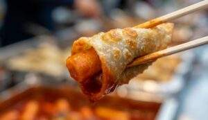 Spicy tteokbokki wrapped in Daegu's famous flat dumplings (Napjak Mandu)