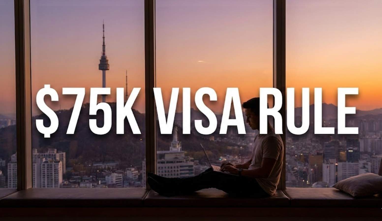 Digital nomad working on laptop overlooking Seoul skyline at sunset with text overlay '$75K VISA RULE'.