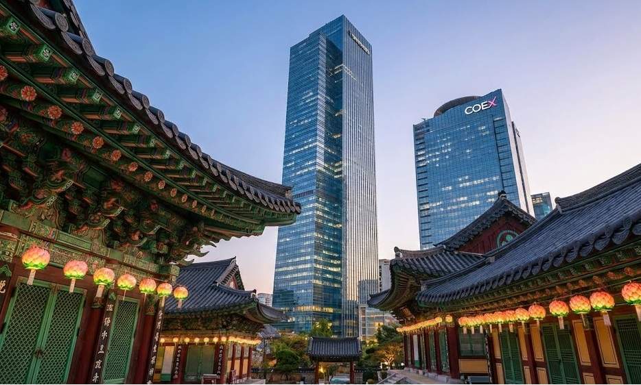 Gangnam Hidden Feng Shui Spot: Twilight view of Bongeunsa Temple in Gangnam with traditional lanterns, contrasting with modern illuminated skyscrapers like the Trade Tower in the background.